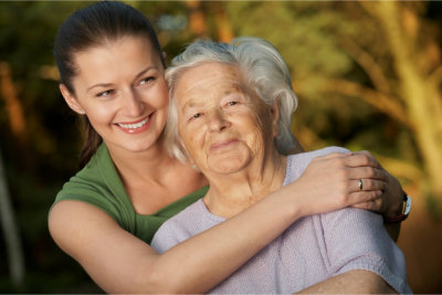 Young woman embracing her grandmother