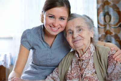 Senior woman with her home caregiver