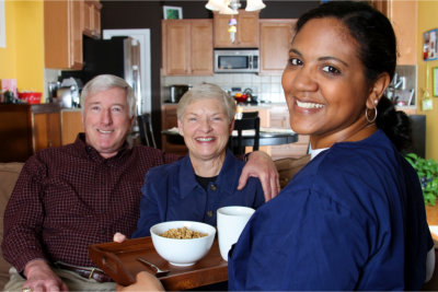 Home care worker and an elderly couple