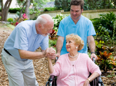 Senior husband visiting his disabled wife